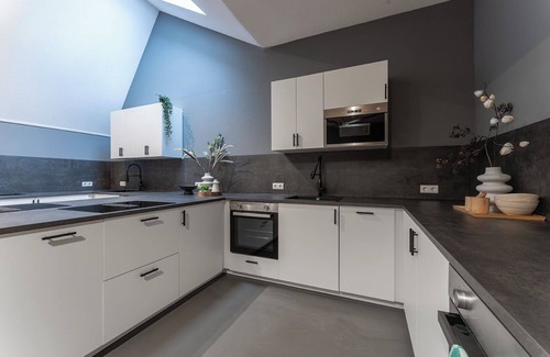 Oss House | Enjoy a stylish stay in our 12-bedroom property each with a private shower and fridge