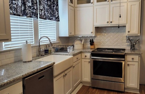 Mount Airy House | Enjoy small-town, Main Street from the front porch of this historic bungalow!