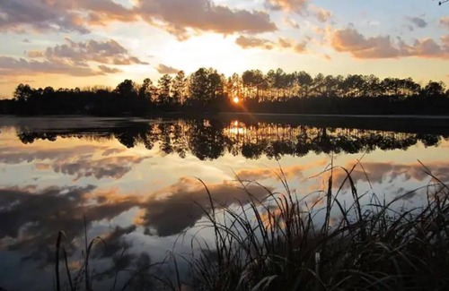 Cordesville House | Enjoy the sunrise on private dock on lake Haskie