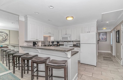 Surfside Beach Condo | Enjoy the warm breeze from your balcony. Baste in the sun. Walk to dinner!n