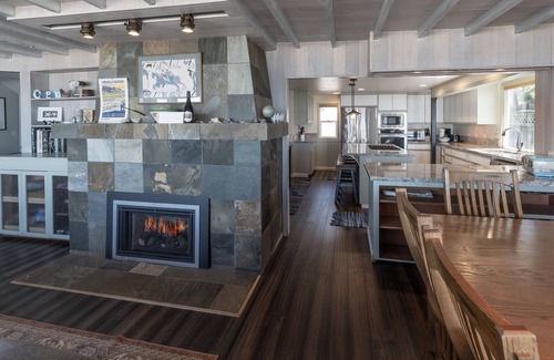 Roads End House | Enjoy the waves in the hot tub at this beachfront home with direct beach access
