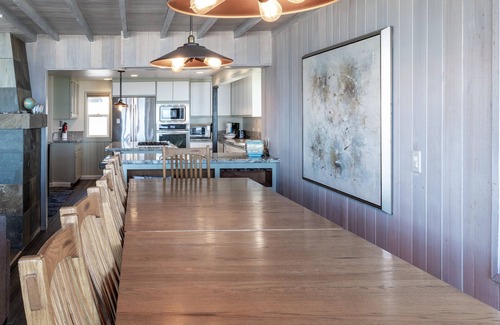 Roads End House | Enjoy the waves in the hot tub at this beachfront home with direct beach access