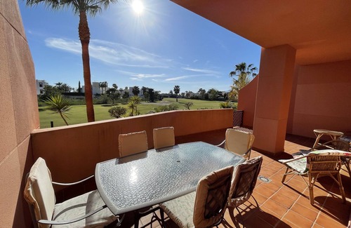 Motril Apartment | Equipado, Terraza de 32 m2 con vistas al campo de golf en Playa Granada.