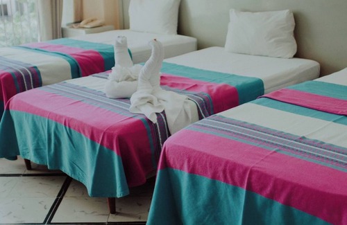 Merida Municipality Hotel | Family + Friends Stay – Two Triple Rooms, Pool Fun, and City Attractions Nearby