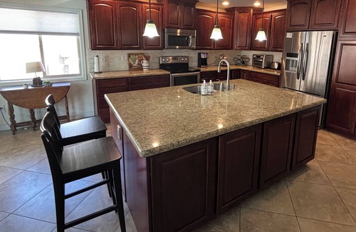 Desert Foothills Estates House | Family oasis with heated pool, desert landscaping and South Mountain views.