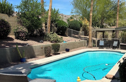 Desert Foothills Estates House | Family oasis with heated pool, desert landscaping and South Mountain views.