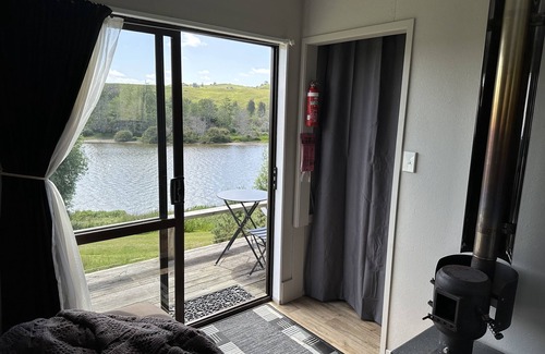 Pukekawa Cabin | Farm Shack with 5-Star River & Sunset Views