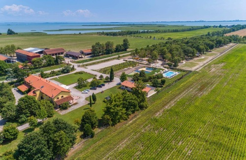Palazzolo dello Stella Apartment | Fattoria 2, spacious apartment in the farm courtyard