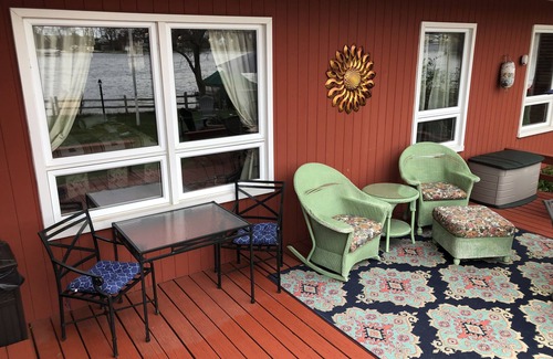 Howell House | Fenced in yard! Lovely Mid Century Feel with all Bedrooms facing the Water!