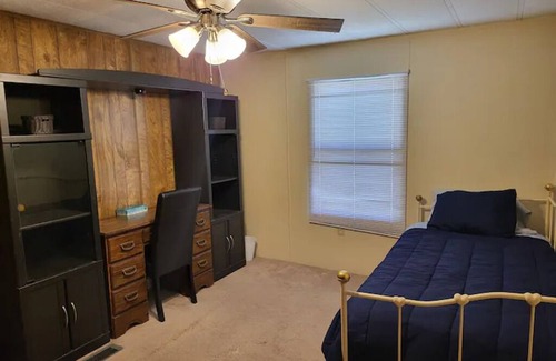 Moodys House | Forget your worries in this spacious and serene lake house in the woods