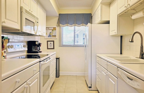 North Litchfield Beach Condo | Fourth Floor Condo Across from Beach Access, Balcony, Pool, Grill Area, Elevator
