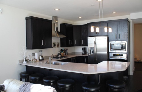 Brian Head Condo | FRONT AND CENTER for 8! PANORAMIC VIEWS! Wall of windows facing slopes! GARAGE!