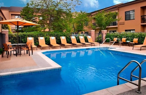 Middletown Apartment | Generously Sized Room Near the Airport w/Hot Tub & 2 Pools Access - Parking