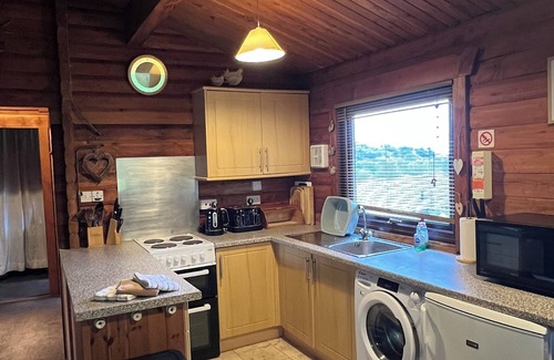 Sandyhills Cabin | Genuine log cabin, Solway Coast. Sleeps 6. Pet friendly. Perfect getaway.