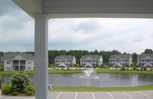 Sunset Beach Condo | GOLF COURSE CONDO - POND VIEWS & FREE NETFLIX