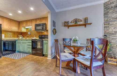 Pigeon Forge Apartment | Golf Course condo w/Free Attraction Tickets, fireplace, sauna, W/D & pool