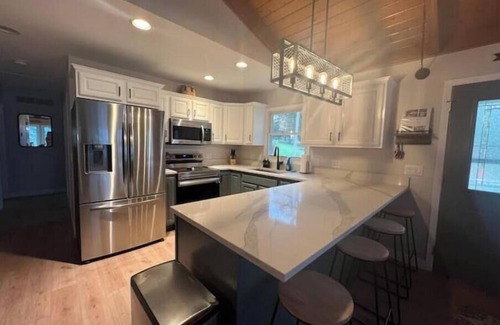 Horicon House | Gorgeous Lakefront Retreat with Waterside Bar Area