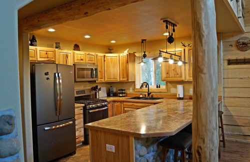 Sutton-Alpine Cabin | Gorgeous Log Cabin With Huge Wraparound Porch