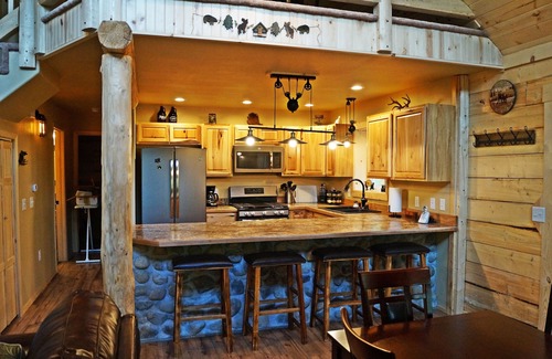 Sutton-Alpine Cabin | Gorgeous Log Cabin With Huge Wraparound Porch