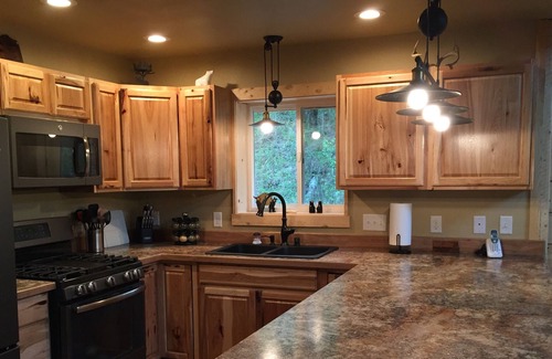 Sutton-Alpine Cabin | Gorgeous Log Cabin With Huge Wraparound Porch