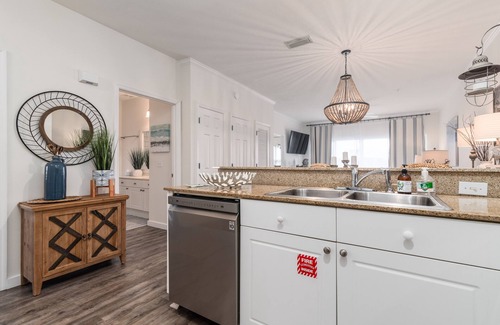 Frangista Beach Condo | Gorgeous renovated condo - Steps from the Beach! Heated Pool! Hot tub!