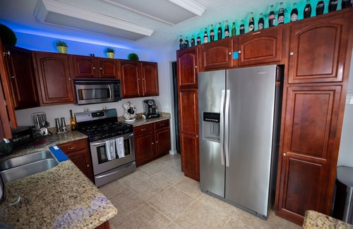 Tropic House | Gorgeous Urban Oasis W/hot Tub, Heated Pool And Private Movie Theater 3 Bedroom Home by RedAwning