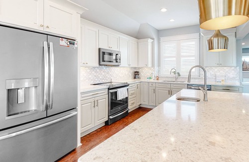 Ocean Isle Estates House | Grand beach home with elevator, private hot tub, game room, & pool access