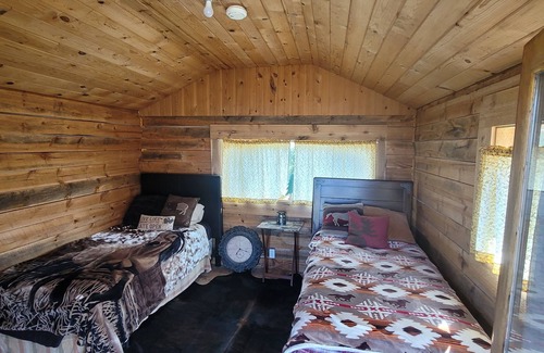 Manhattan Cabin | GRIZZLY ROCK RANCH Rustic Tiny Log Cabin Glamping and Horseback Riding Available