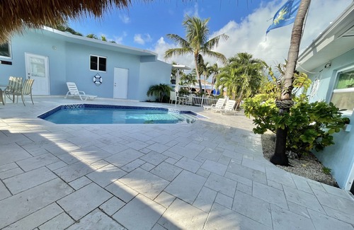 Farara Shores House | Ground level house with pool and canal to ocean