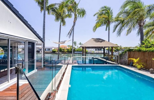 Runaway Bay House | Harborview Bliss: 4BR Coastal Retreat w/Pool