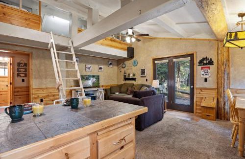 Island Park House | Hayloft Hollow by KABINO Fire Pit Fireplace Loft with Low Ceiling High Chair WiFi