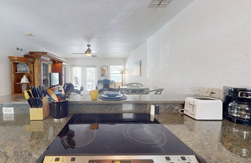 Pass-a-Grille Historic District Condo | Heart of Pass-A-Grille Beach! Beach Across the Street ~ Community Heated Pool ~ Beach-facing Balcony