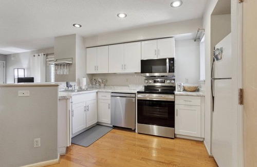 Speer Condo | Hip Historic Baker Area Condo - Individual Garage Parking Included!