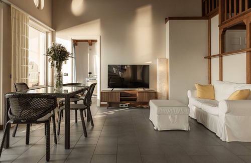 Reno House | Holiday Home 'Attico Borromea' with Lake View, Shared Pool and Wi-Fi