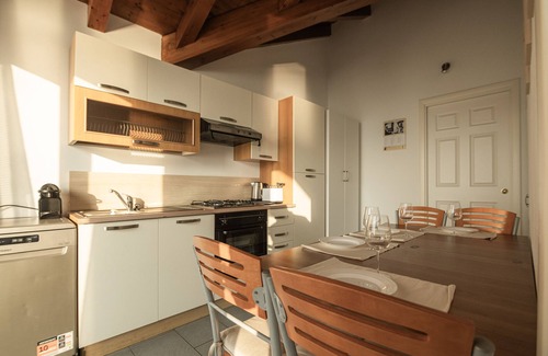 Reno House | Holiday Home 'Attico Borromea' with Lake View, Shared Pool and Wi-Fi