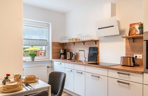 Neuengroden House | Holiday Home 'Kuh' with Private Terrace, Balcony and Wi-Fi