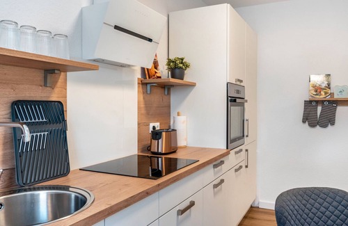 Neuengroden House | Holiday Home 'Kuh' with Private Terrace, Balcony and Wi-Fi