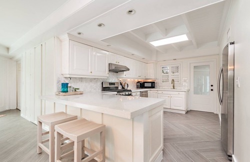 Central Beach House | Home Gem! Heated pool, lush backyard a block from the ocean on Central Beach!
