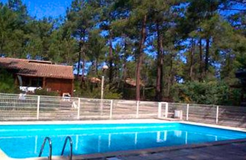 Carcans Ski Chalet | Homerez - Beautiful chalet for 5 ppl. with shared pool and terrace at Carcans