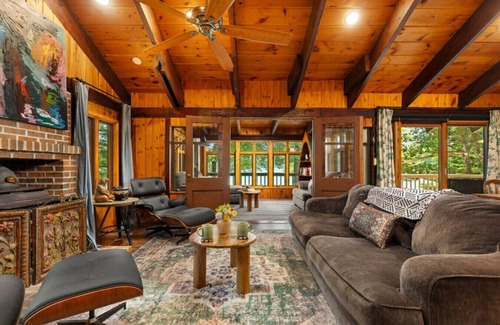 Newaygo House | Hot Tub, Water Amenities, Lakeshore Cottage