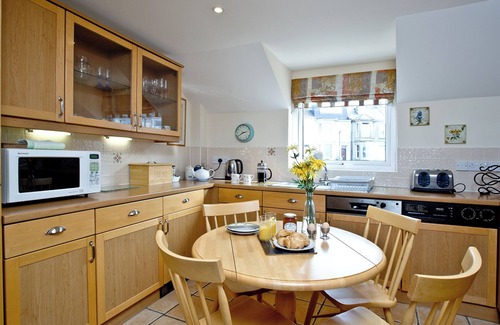 Brixham Apartment | Ideally located on Brixham marina offering far reaching sea views.