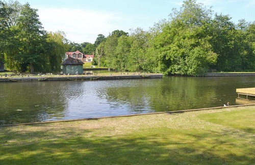 Wroxham Cottage | Imagine relaxing on the patio, watching the boats and river life pass by.