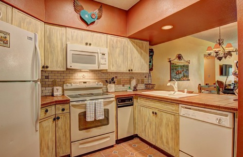 New Braunfels Condo | Immaculate Comal riverfront! Across from Schlitterbahn! Pool & river access!