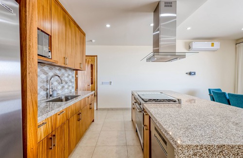 Libertad Apartment | Immaculate stay with stunning views, balcony, plus on-site pool & gym