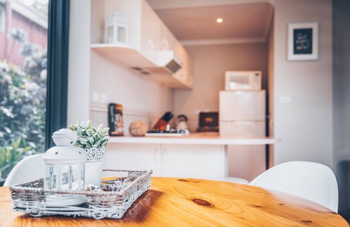 Coles Bay Apartment | In the heart of town, ocean & mountain views, opposite waterfront. Free wifi.