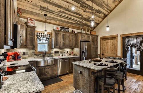 Ellijay Cabin | Indulge in romance at French Kisses! This new, pet-friendly cabin offers a hot tub, fire table, and WiFi for an unforgettable getaway