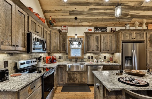 Ellijay Cabin | Indulge in romance at French Kisses! This new, pet-friendly cabin offers a hot tub, fire table, and WiFi for an unforgettable getaway