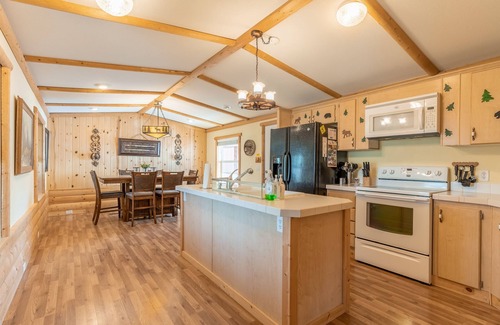 Polson House | Inviting lake view home with fireplace, golf nearby, full kitchen, & W/D
