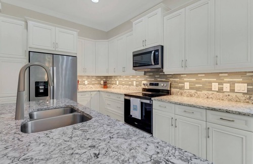 Isles of Collier Preserve Apartment | Isles of Collier | 3 bedrooms | 3 bathrooms | a den/office | sunroom | 2-car garage.