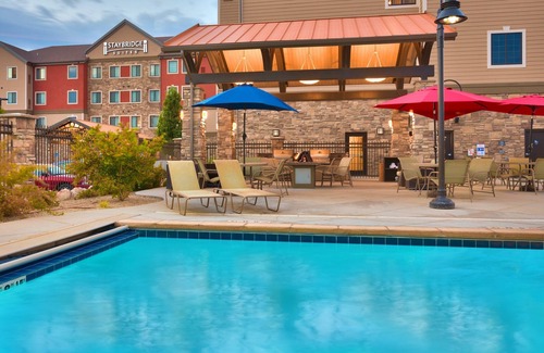 Midvale Apartment | King Suite | Heated Pool & Hot Tub. Free Breakfast Buffet. Near Jordan Landing!